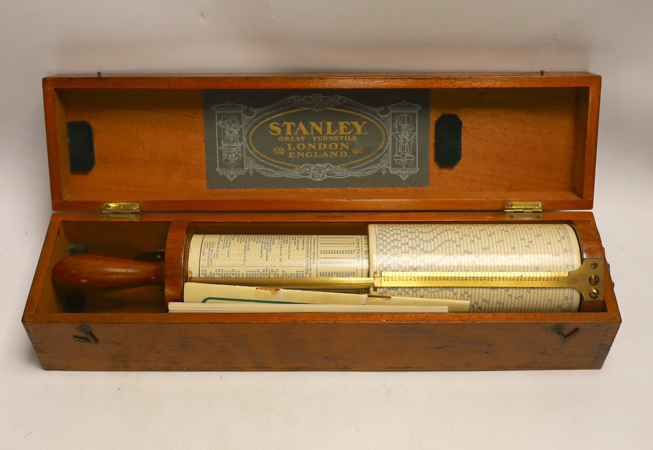 A teak cased Stanley Fuller calculator with instruction booklet, case 45.5cm